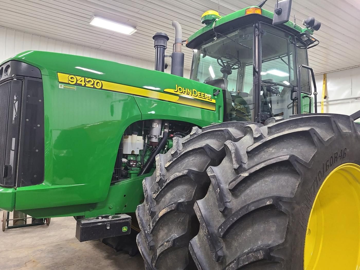 Close view of a John Deere 9420 tractor and its rear tires after cleaning